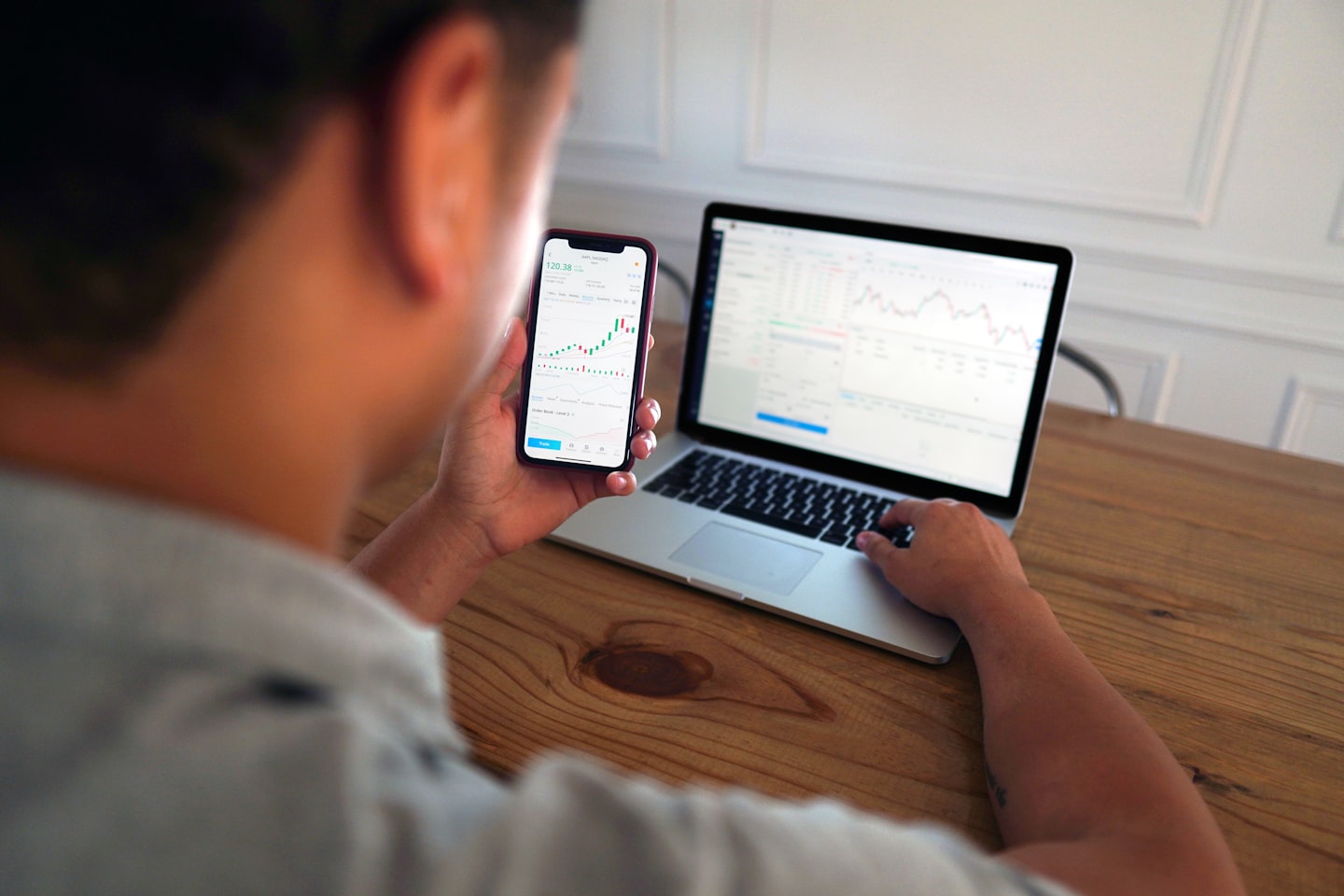 Business owner reviewing community platform software features and pricing on a laptop